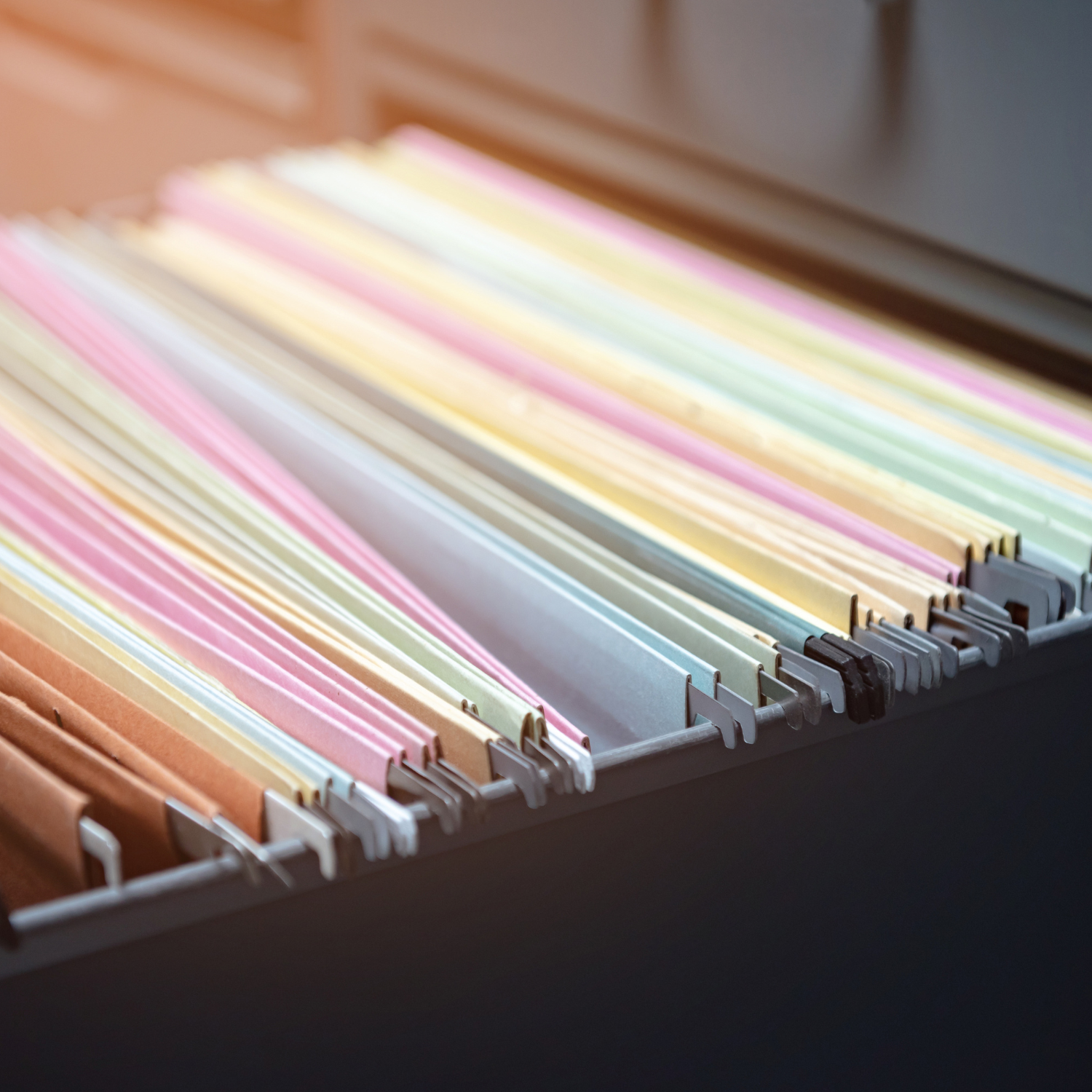 Organized legal documents in a folder with signature tabs and pen for a notary appointment.